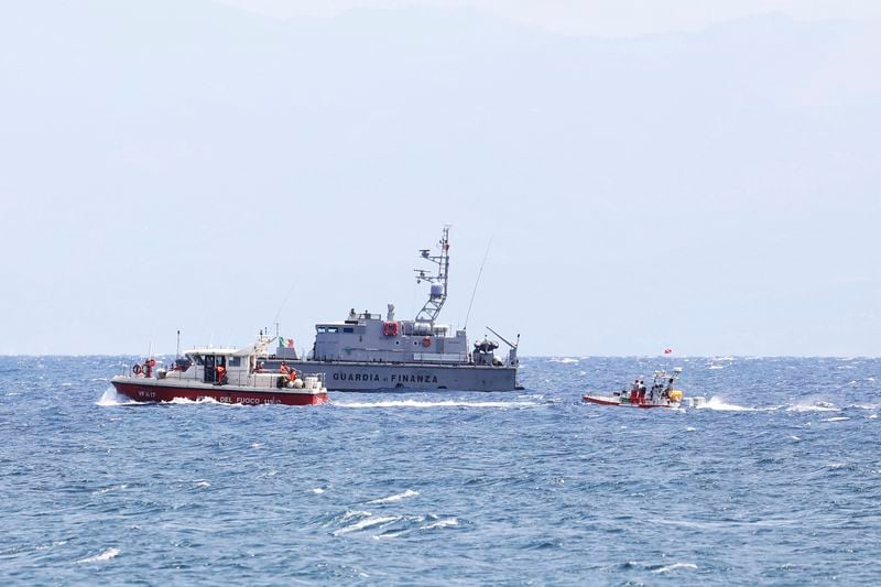 Emergency services at the scene of the search for a missing boat, in Porticello Santa Flavia, Italy, Monday, Aug. 19, 2024. British tech giant Mike Lynch, his lawyer and four other people are among those missing after their luxury superyacht sank during a freak storm off Sicily, Italy’s civil protection and authorities said. Lynch’s wife and 14 other people survived. (Alberto Lo Bianco /LaPresse via AP)