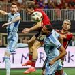 Atlanta United midfielder Saba Lobzhanidze (9) cannot connect with a header during the first half of an MLS soccer match against CF Montreal on Wednesday, Oct. 2, 2024, in Atlanta. (Miguel Martinez/Atlanta Journal-Constitution via AP)