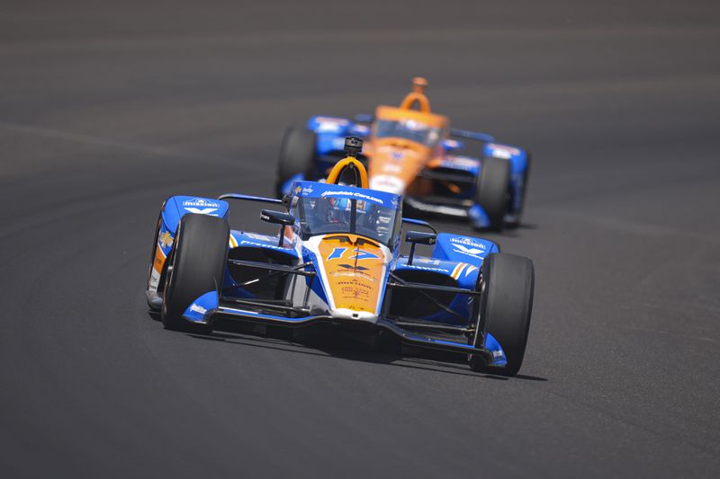 Kyle Larson drives through the first turn during the final practice for the Indianapolis 500 auto race at Indianapolis Motor Speedway in Indianapolis, Friday, May 24, 2024. (AP Photo/Michael Conroy)