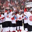 FILE - Canada's Sidney Crosby (87) hoists the trophy in front of teammates following Canada's 2-1 victory over Europe in Game 2 of the final to win the World Cup of Hockey, in Toronto, Sept. 29, 2016. (Frank Gunn/The Canadian Press via AP, File)