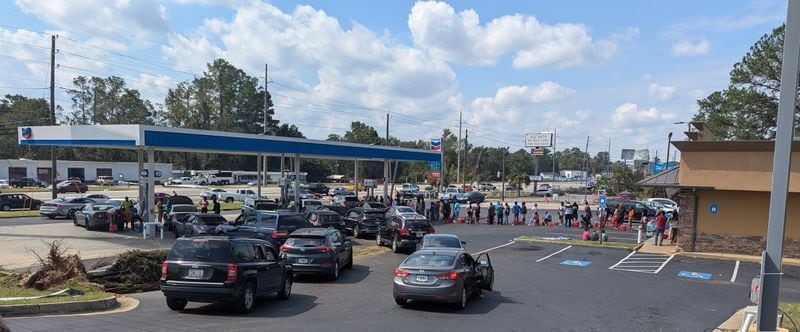 Cars and residents waited in lines for hours on Sunday, September 29, 2024, to get gas at a Chevron, one of the few stations in town with working pumps.