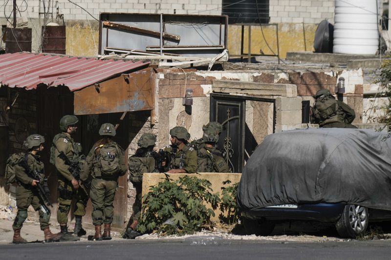 Israeli soldiers are seen during an army raid in Tubas, West Bank, on Wednesday, Sept. 11, 2024. (AP Photo/Majdi Mohammed)