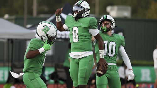 Roswell quarterback Trey Smith (8) celebrates with teammates after his 55-yard touchdown run during the first half against Seckinger at Roswell High School, Friday, Sept. 20, 2024, in Roswell, Ga. (Jason Getz / AJC)

