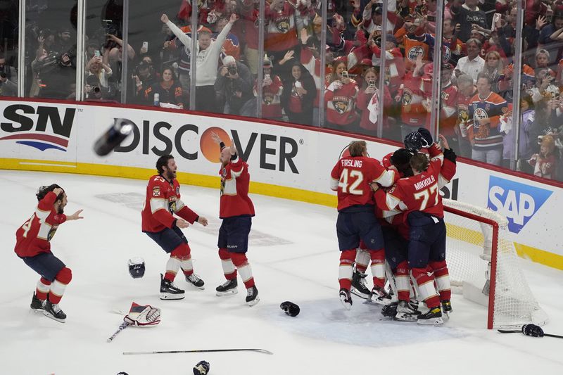 Florida Panthers players celebrate after defeating the Edmonton Oilers in Game 7 of the NHL hockey Stanley Cup Final, Monday, June 24, 2024, in Sunrise, Fla. (AP Photo/Rebecca Blackwell)