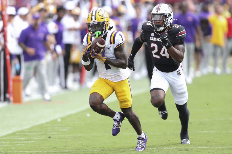 LSU wide receiver Aaron Anderson (1) makes a catch for a 46-yard gain ahead of South Carolina defensive back Jalon Kilgore (24) during the second half of an NCAA college football game Saturday, Sept. 14, 2024 in Columbia, S.C. (AP Photo/Artie Walker Jr.)