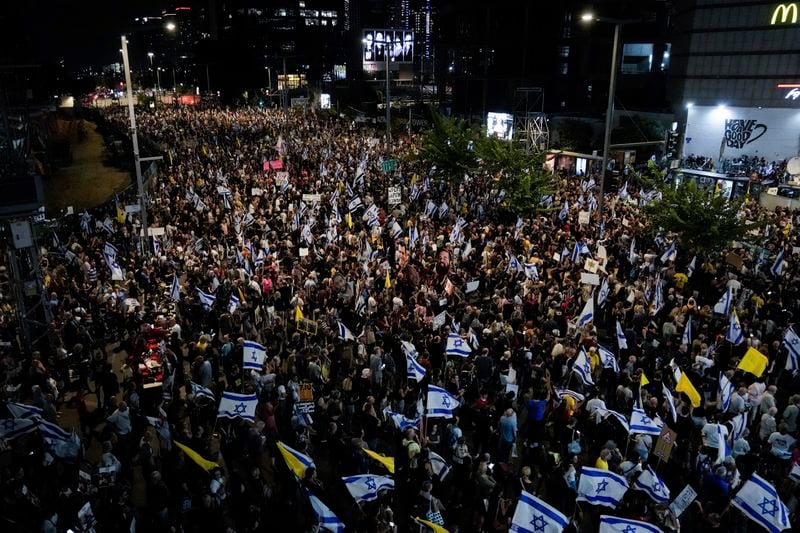 People protest against Prime Minister Benjamin Netanyahu's government and call for the release of hostages held in the Gaza Strip by the Hamas militant group, in Tel Aviv, Israel, Saturday, Sept. 14, 2024. (AP Photo/Mahmoud Illean)