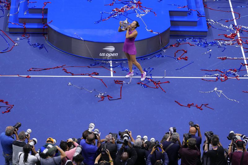 Aryna Sabalenka, of Belarus, kisses the trophy after winning the women's singles final of the U.S. Open tennis championships against Jessica Pegula, of the United States, Saturday, Sept. 7, 2024, in New York. (AP Photo/Kirsty Wigglesworth)