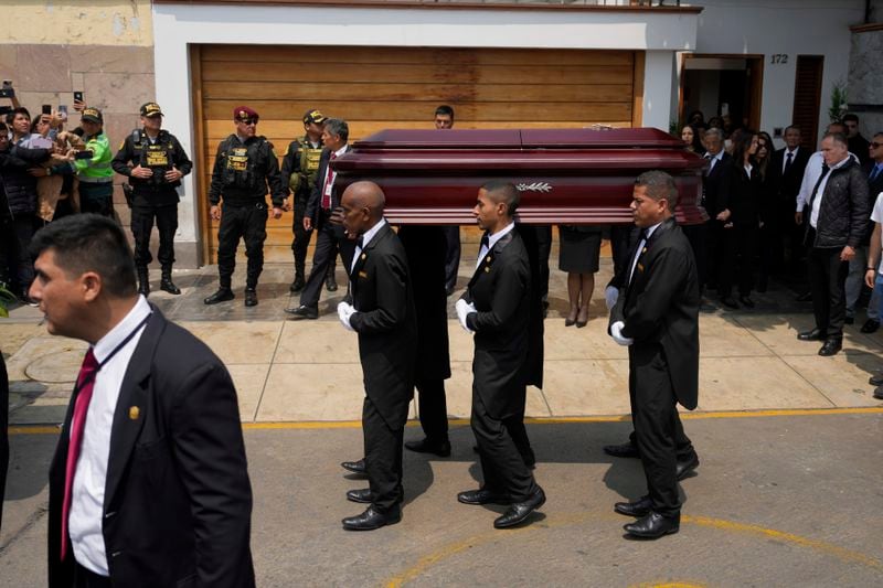 Pallbearers carry the coffin of former President Alberto Fujimori from the home of his daughter Keiko, the day after he died in Lima, Peru, Thursday, Sept. 12, 2024. (AP Photo/Guadalupe Pardo)