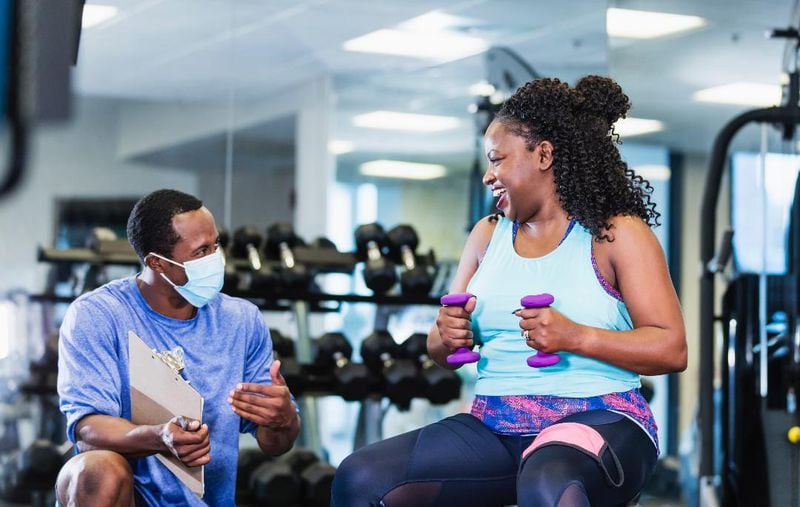 A coach offers fitness tips and support at the YMCA of Metro Atlanta, which has a six-month program to help members lose weight and get healthier. Photo courtesy of the YMCA of Metro Atlanta.