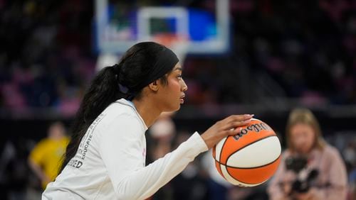 Chicago Sky's Angel Reese warms up before a WNBA basketball game against the Indiana Fever, Friday, Aug. 30, 2024, in Chicago. (AP Photo/Erin Hooley)