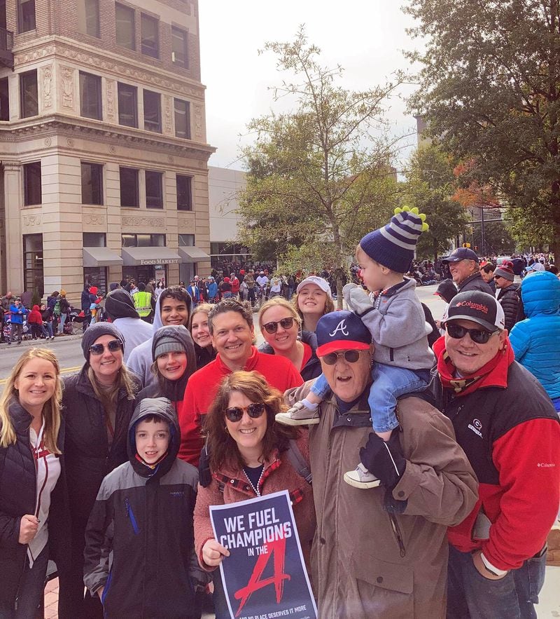 For Emily Markette attends the parade Friday, Nov. 5, 2021, with nearly a dozen family members spanning three generations. (J.D. Capelouto / The Atlanta Journal-Constitution)