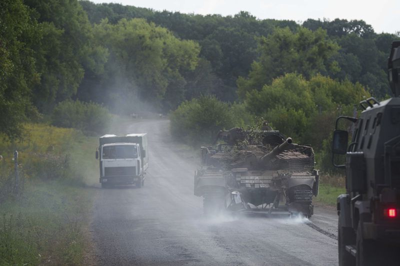 A damaged Ukrainian tank returns from Russia near the Russian-Ukrainian border in Sumy region, Ukraine, Thursday, Aug. 15, 2024. (AP Photo/Evgeniy Maloletka)