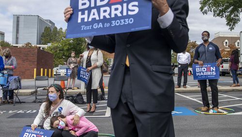 10/12/2020 - Decatur, Georgia - Sarah Bernstein comforts her daughter Harper Adkins-Bernstein as Dr. Jill Biden speaks during a rally for Presidential Democratic nominee Joe Biden and Vice President nominee Kamala Harris in downtown Decatur, Monday, October 12, 2020.  (Alyssa Pointer / Alyssa.Pointer@ajc.com)