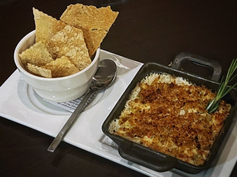 The Ashford's gulf shrimp and artichoke dip is likely to be a popular appetizer at your table. Henri Hollis/henri.hollis@ajc.com