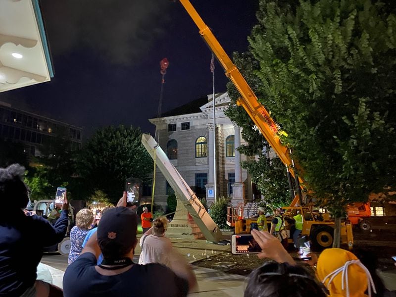 A 30-foot obelisk Confederate moment, which has stood for 112 years, was taken down in the downtown Decatur square late Thursday night. The monument was erected in 1908 by the United Daughters of the Confederacy. Photos by Amanda Coyne / AJC