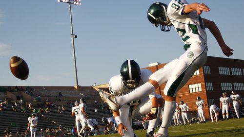 Westminster's Harrison Butker (82) practices kicking a field goal before a 2010 game against Buford.