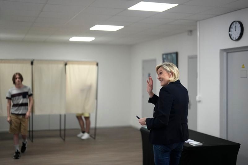 FILE - French far right leader Marine Le Pen arrives to vote, Sunday, June 30, 2024 in Henin-Beaumont, northern France. Le Pen easily won her own race for a parliamentary seat in the first-round voting last Sunday — she garnered more than 64% of the votes in Henin-Beaumont, once a leftist stronghold. (AP Photo/Thibault Camus, File)