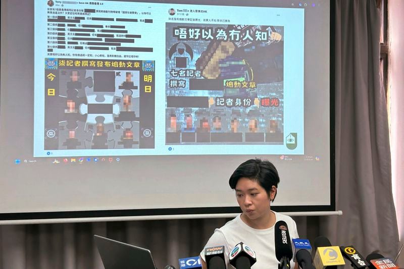 Selina Cheng, chair of the Hong Kong Journalists Association, shares intimidating Facebook posts against some of the city's journalists at a news conference in Hong Kong Friday, Sept. 13, 2024. (AP Photo/Kanis Leung)