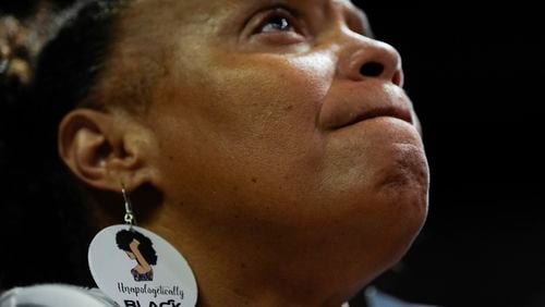 FILE - A supporter wearing earrings that read "Unapologetically Black" listens during a campaign rally for Democratic presidential nominee Vice President Kamala Harris, Aug. 10, 2024, in Las Vegas. (AP Photo/Julia Nikhinson, File)