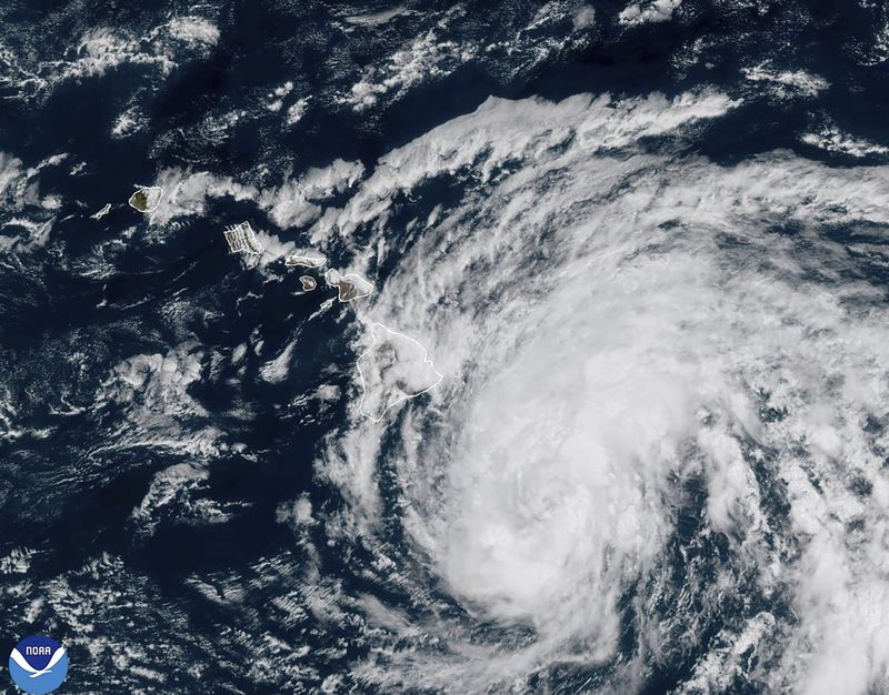 This image provided by the National Oceanic and Atmospheric Administration shows Tropical Storm Hone as it continues to track to the west toward the Hawaiian Islands, Saturday, Aug. 24, 2024. (National Oceanic and Atmospheric Administration via AP)