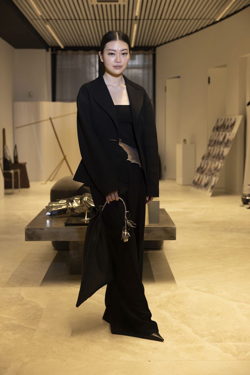 Singapore designer Grace Ling poses in her showroom where she displays her 3D printed designs on Friday, Sept. 13, 2024, in New York. Ling, a CFDA/Vogue Fashion Fund finalist, showcased her latest collection at New York Fashion Week. (Photo by Matt Licari/Invision/AP)