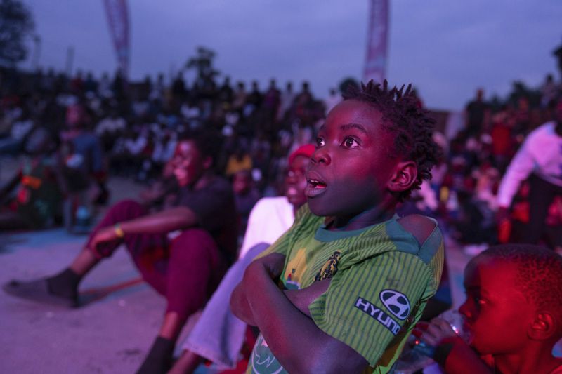 A young spectator looks at a dance performance in Goma, Democratic Republic of the Congo, Saturday, June 15, 2024, during the annual Goma Dance Festival. (AP Photo/Moses Sawasawa)