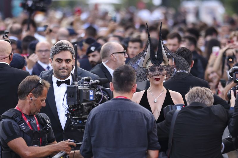 Michael Polansky, left, and Lady Gaga upon arrival for the premiere of the film 'Joker: Folie A Deux' during the 81st edition of the Venice Film Festival in Venice, Italy, on Wednesday, Sept. 4, 2024. (Photo by Vianney Le Caer/Invision/AP)