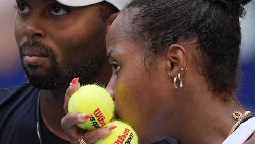 Taylor Townsend, of the United States, right, and Donald Young, of the United States, talk at the baseline before serving to Sara Errani, of Italy, and Andrea Vavassori, of Italy, during the mixed doubles final of the U.S. Open tennis championships, Thursday, Sept. 5, 2024, in New York. (AP Photo/Julia Nikhinson)