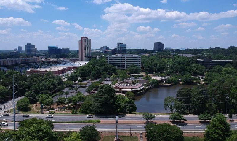 Developer plans to build a mixed-use shopping center in this space. The plan involves paving over a pond. HYOSUB SHIN / HSHIN@AJC.COM