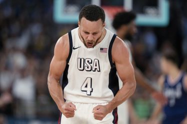 United States' Stephen Curry (4) celebrates a basket against Serbia during a men's semifinals basketball game at Bercy Arena at the 2024 Summer Olympics, Thursday, Aug. 8, 2024, in Paris, France. The U.S. won 95-91. (AP Photo/Mark J. Terrill)