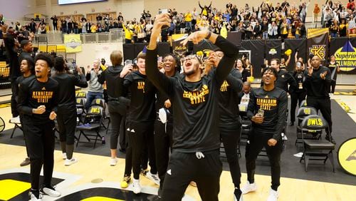 Kennesaw State players react after finding out they will play No. 3-seed Xavier. The first-round NCAA Tournament game is scheduled for 12:40 p.m. Friday in Greensboro, North Carolina. (Miguel Martinez /miguel.martinezjimenez@ajc.com)
