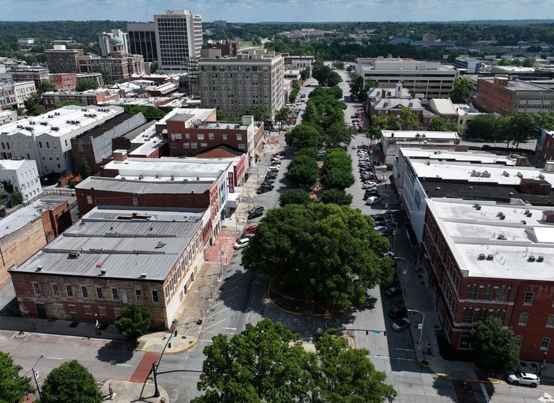 Tree-lined Third Street Park in downtown Macon. Seen at lower right is the Dannenberg building at the corner of Third and Poplar streets. (Hyosub Shin / AJC)