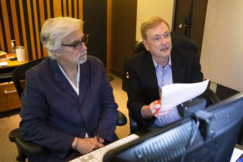 Donal Jones (left), director of production for the Day1 radio show, and Rev. Peter Wallace review the recording for the Day1radio show. CHRISTINA MATACOTTA FOR THE ATLANTA JOURNAL-CONSTITUTION.