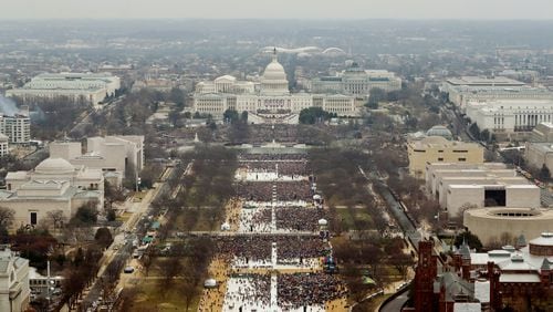 WASHINGTON, DC - JANUARY 20: Attendees line the Mall as they watch ceremonies to swear in Donald Trump on Inauguration Day on January 20, 2017 in Washington, DC. Donald J. Trump will become the 45th president of the United States today. (Photo by Lucas Jackson - Pool/Getty Images)