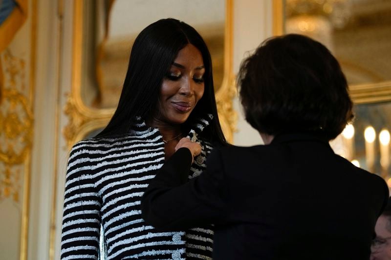 French Culture Minister Rachida Dati, right, awards Naomi Campbell with the medal of "Chevalier de l'Ordres des Arts et des Lettres", at the Culture ministry, in Paris, Thursday, Sept. 26, 2024. (AP Photo/Louise Delmotte)