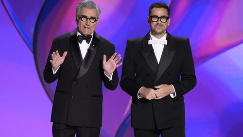 Hosts Eugene Levy, left, and Dan Levy speak during the 76th Primetime Emmy Awards on Sunday, Sept. 15, 2024, at the Peacock Theater in Los Angeles. (AP Photo/Chris Pizzello)