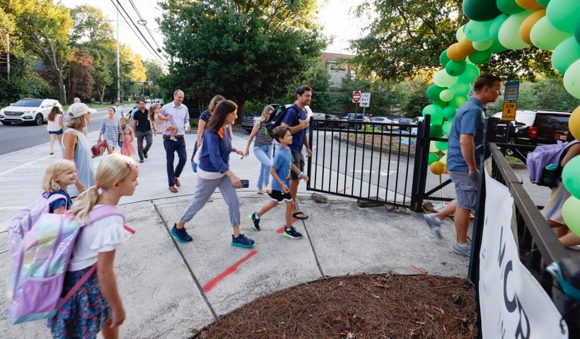 Parents and students arrive for the first day of school at Springdale Park Elementary School in Atlanta on Tuesday, August 1, 2023.   (Bob Andres for the Atlanta Journal Constitution)