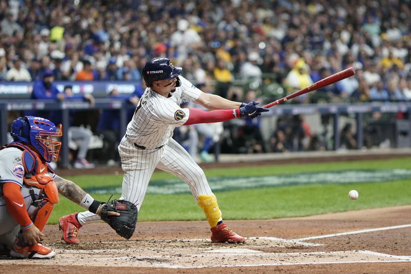 Milwaukee Brewers' Willy Adames hits a single during the fourth inning of Game 3 of a National League wild card baseball game against the New York Mets Thursday, Oct. 3, 2024, in Milwaukee. (AP Photo/Morry Gash)