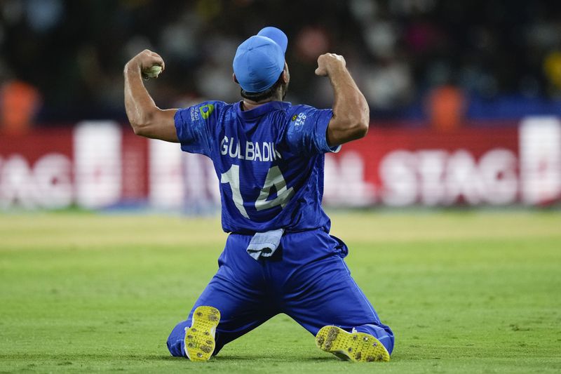 Afghanistan's Gulbadin Naib celebrates after defeating Australia by 21 runs in their men's T20 World Cup cricket match at Arnos Vale Ground, Kingstown, Saint Vincent and the Grenadines, Saturday, June 22, 2024. (AP Photo/Ramon Espinosa)