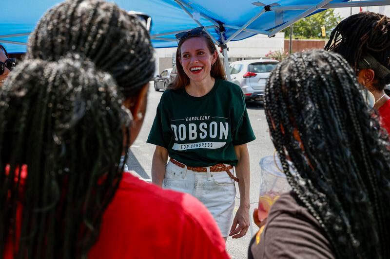 Alabama's new 2nd Congressional District Republican candidate Caroleene Dobson talks with voters during the Macon County Day Festival in Tuskegee, Ala., on Saturday, Aug 31, 2024. (AP Photo/ Butch Dill)