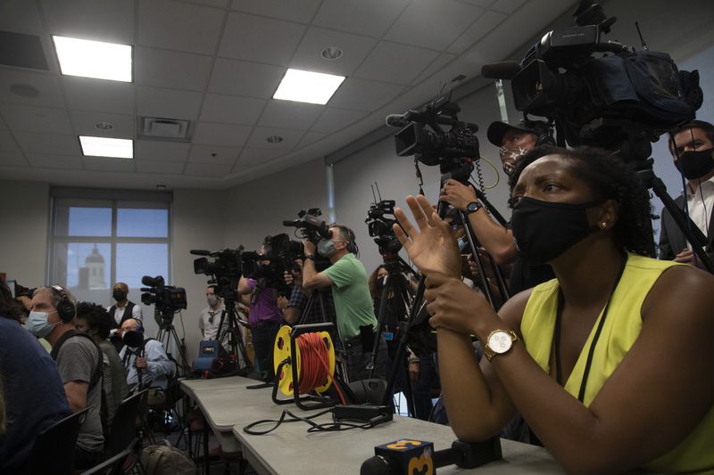 Reporters ask questions after Pasquotank County District Attorney Andrew Womble announced he will not charge deputies in the April 21 fatal shooting of Andrew Brown Jr. 