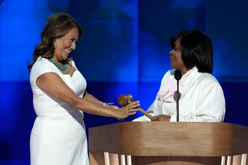 Rep. Veronica Escobar, D-Texas, left, and Minyon Moore, Chair of the 2024 Democratic National Convention Committee, appear on stage before they gavel in during the Democratic National Convention, Thursday, Aug. 22, 2024, in Chicago. (AP Photo/J. Scott Applewhite)