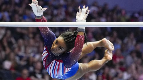 FILE - Simone Biles competes on the uneven bars at the United States Gymnastics Olympic Trials on Sunday, June 30, 2024, in Minneapolis. (AP Photo/Abbie Parr, File)
