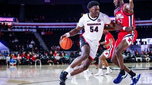 Georgia center Russel Tchewa drives against Ole Miss at Stegeman Coliseum on Tuesday, Mar. 5, 2024. (Cassie Baker/UGAAA)