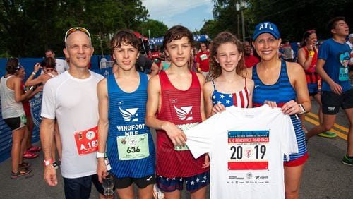 Emily Giffin (right) with her family at The Atlanta Journal-Constitution Peachtree Road Race in 2019.