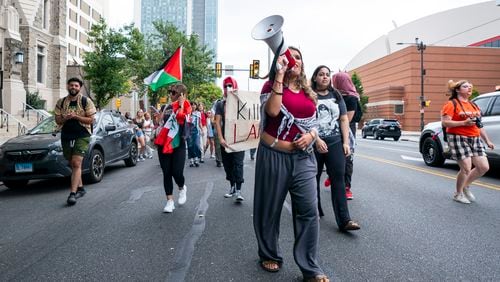 Alia Amanpour Trapp, center, leads the crowd during a pro-Palestine rally and march on Temple University campus in Philadelphia, Aug. 29, 2024. (AP Photo/Chris Szagola)