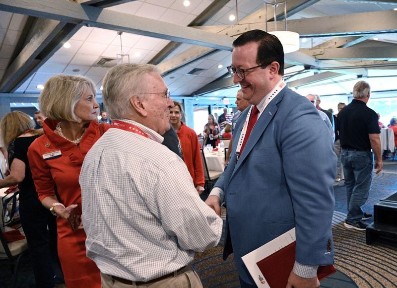 Georgia Republican Party chairman Josh McKoon (right) is greeted by Alton Russell, delegate from Columbus, during Georgia delegation breakfast at Lake Lawn Resort, Monday, July 15, 2024, in Delavan, WI. (Hyosub Shin / AJC)