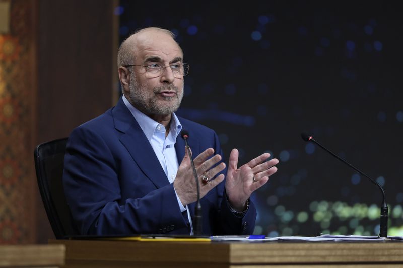 In this photo released by the Iranian state-run TV, IRIB, Iran's Parliament Speaker Mohammad Bagher Qalibaf, a presidential candidate for June 28 election, speaks in a debate of the candidates at the TV studio in Tehran, Iran, Thursday, June 20, 2024. (Morteza Fakhri Nezhad/IRIB via AP)