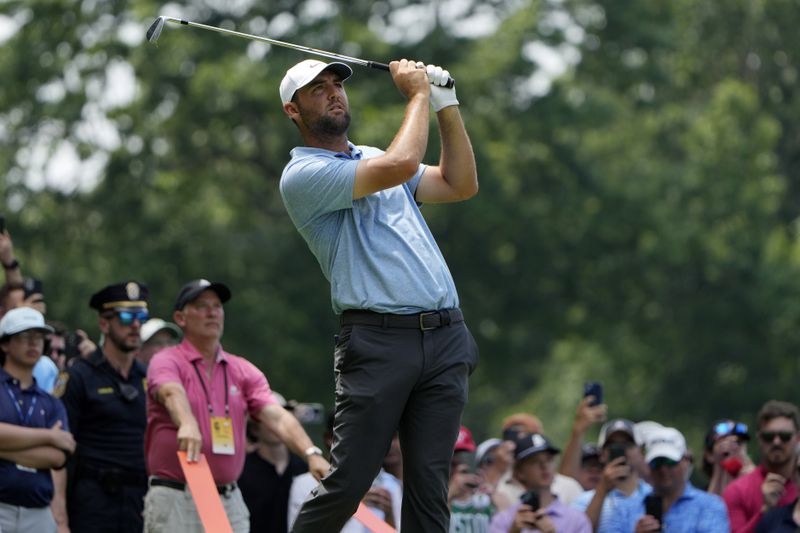 Scottie Scheffler tees off on the 11th hole during the final round of the Travelers Championship golf tournament at TPC River Highlands, Sunday, June 23, 2024, in Cromwell, Conn. (AP Photo/Seth Wenig)