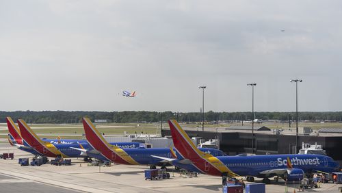 Southwest Airlines planes can be seen on the terminal at Baltimore/Washington International Thurgood Marshall Airport in Baltimore, Friday, July 19, 2024, in Baltimore. (AP Photo/Stephanie Scarbrough)